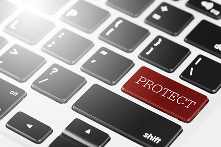 PROTECT Red button keyboard on laptop computer for Business an, a Technology Photo by Ministocker