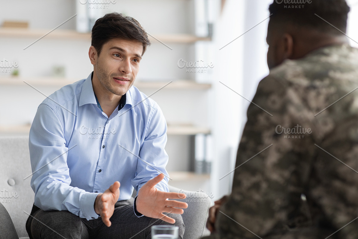 depressed military guy standing next to window, closeup, a Photo by Prostock-Studio (Photo 2 of 3)