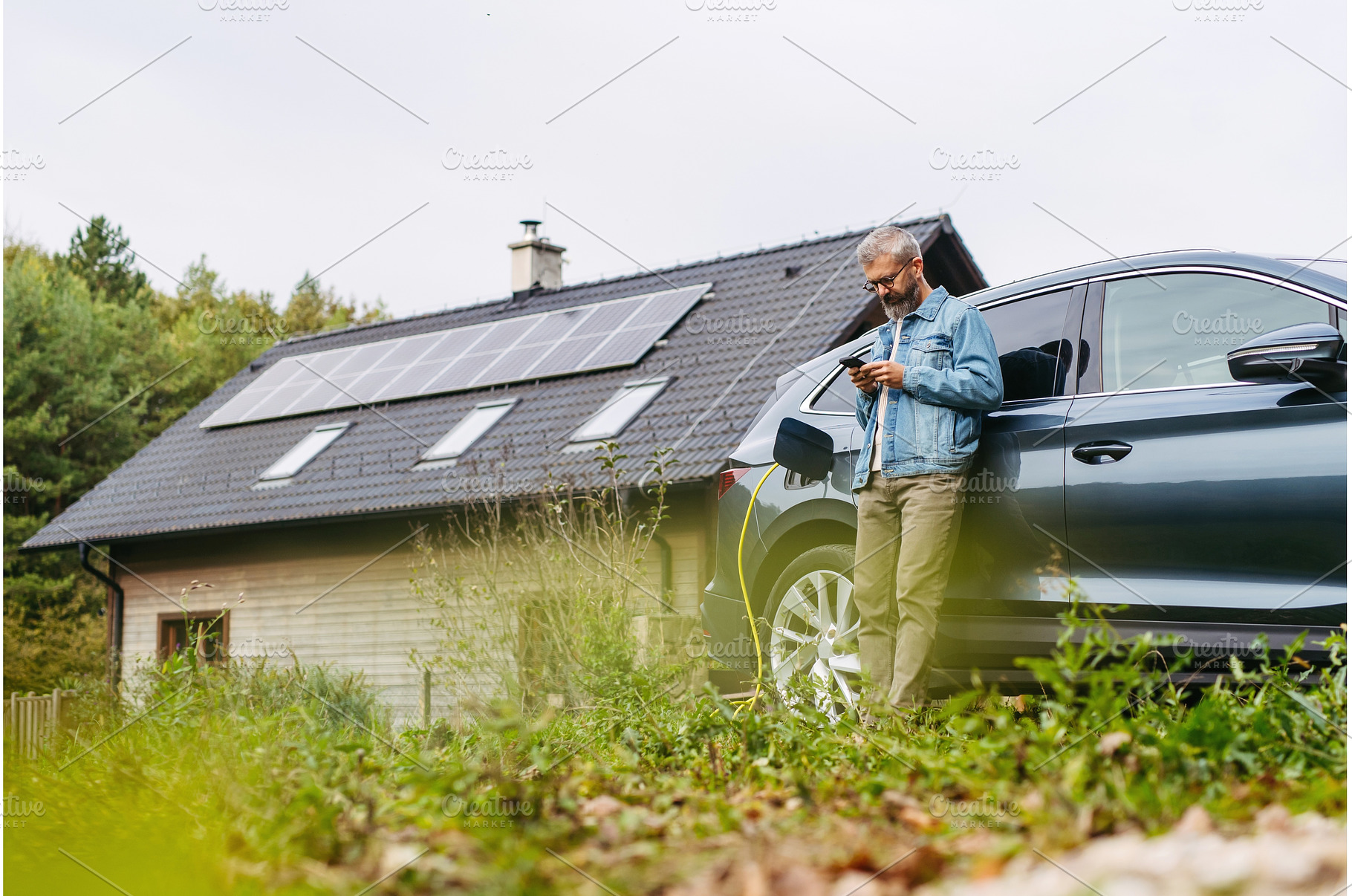 Charging electric car at home, using, a Transportation Photo by HalfPoint
