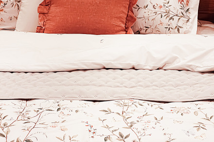 Vintage countryside style bedding with floral pattern on wooden, an Architecture Photo by Anneleven