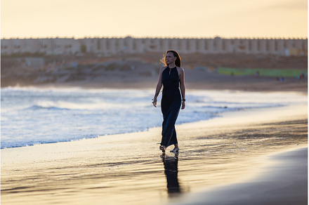 Young beautiful woman in long dress, a Person Photo by serkum
