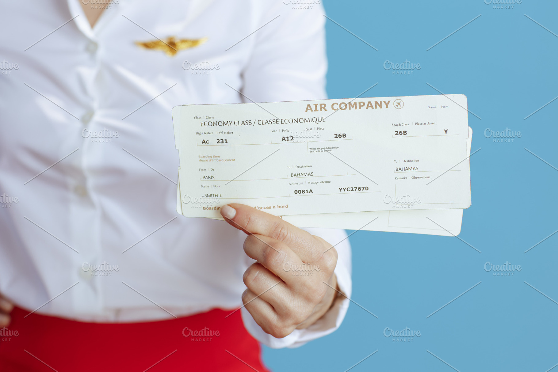 Closeup on elegant air hostess woman on blue, a Business Photo by Alliance Images