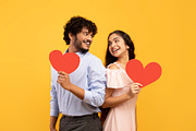 Valentine's holiday. Portrait of indian lovers holding red paper hearts and loo, a Photo by Prostock-Studio (Thumbnail 4 of 5)