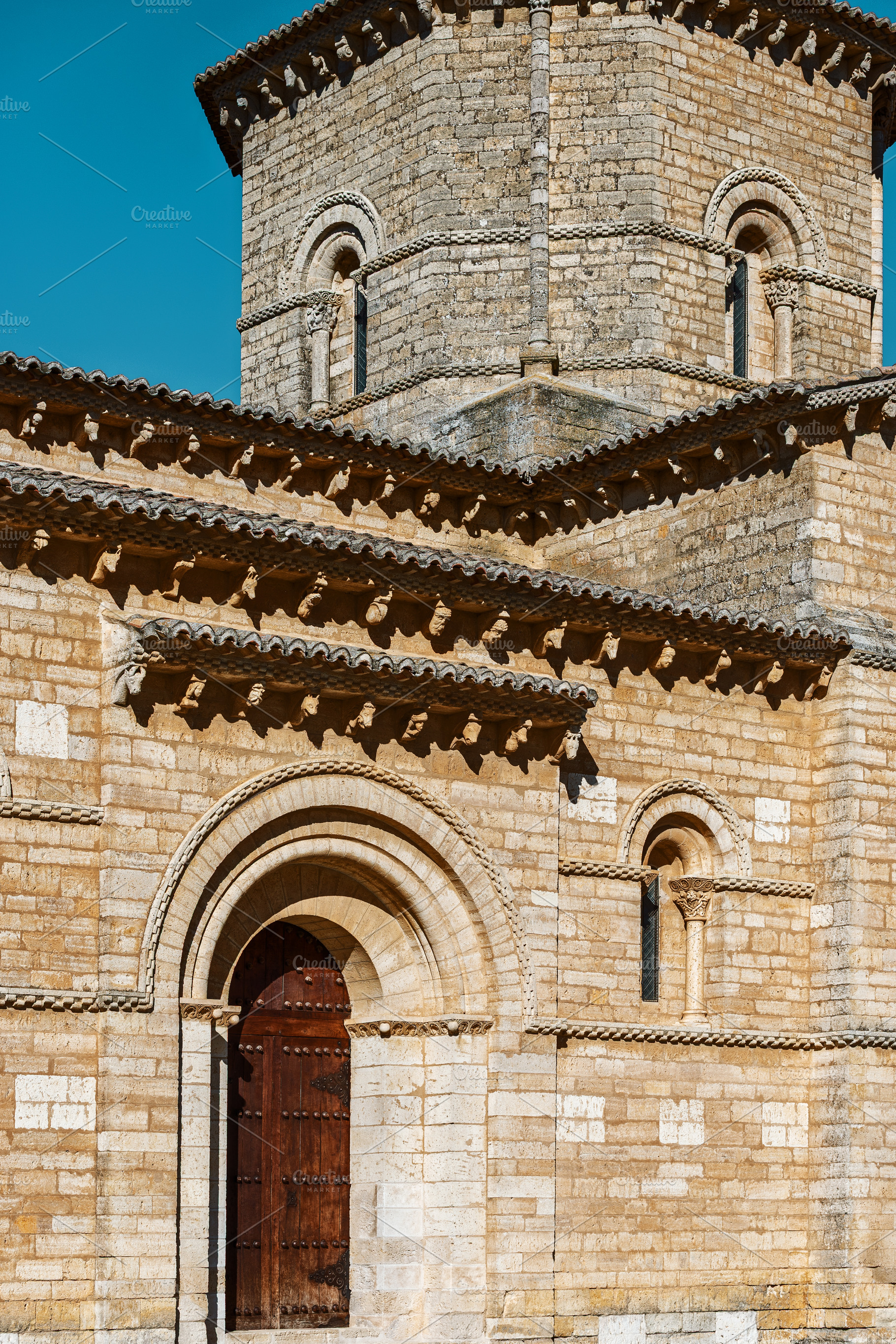 Romanesque stone church under a blue, an Architecture Photo by Perpis