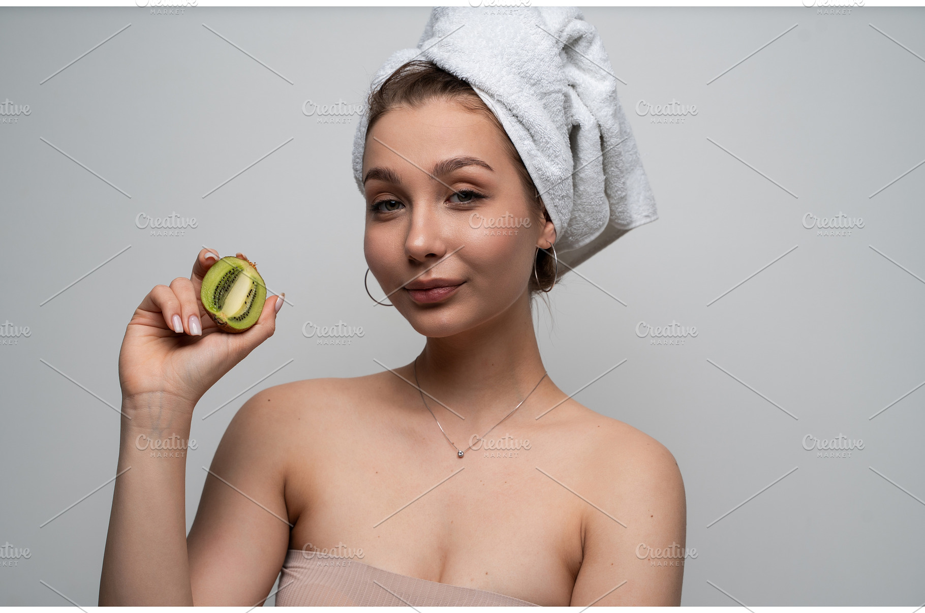 Woman with a towel on her head, a Health & Medical Photo by volodymyrshtun13795