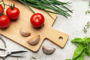 Fresh herbs, spices, tomatoes and garlic creating a frame on kit, a Food & Drink Photo by Olena Rudo
