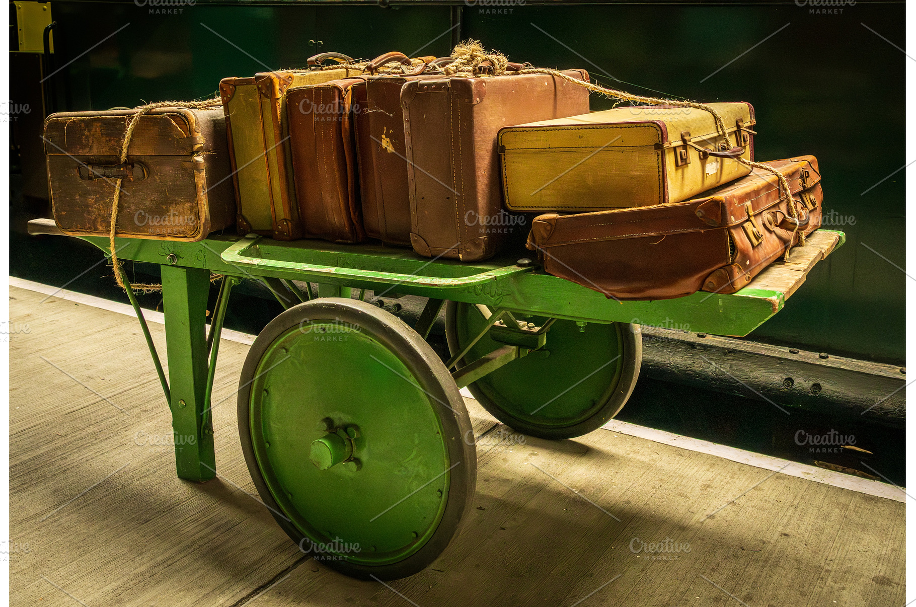 Historic antique luggage cart with, a Transportation Photo by Backyard Stock
