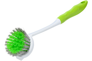 Green plastic brush for washing dishes or cleaning with long whi, an Abstract Photo by ndanko