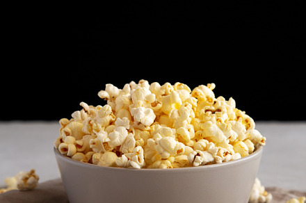 Homemade Salty Popcorn in a Bowl, side view., a Food & Drink Photo by LiudmylaChuhunova