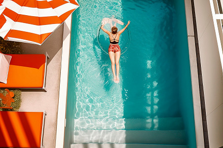 Girl in the pool from above, a Person Photo by huertas19