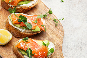 Salmon avocado bruschetta with cream cheese and greens, a Food & Drink Photo by Olena Rudo