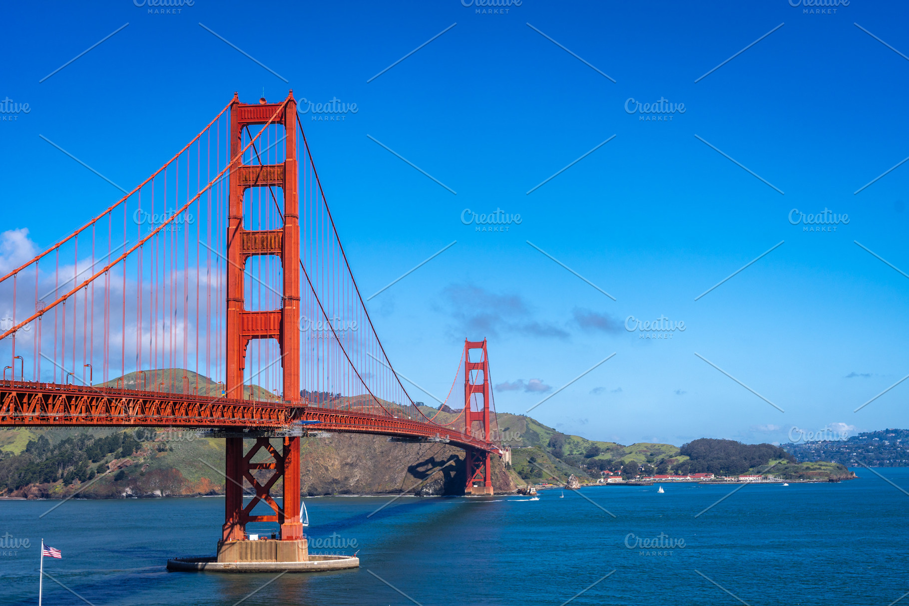 Golden Gate Bridge over blue waters with scenic hills in San Fra, an Architecture Photo by GoodGoods