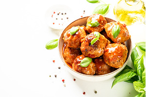 Meatballs in tomato sauce on white, a Food & Drink Photo by Nadia-nb