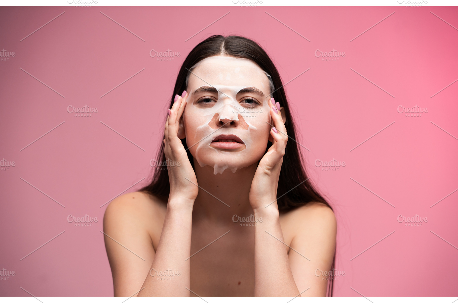 Woman applying hydrating sheet face, a Health & Medical Photo by volodymyrshtun13795
