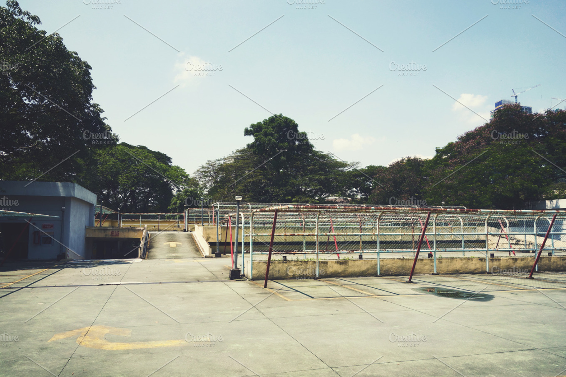 Empty parking lot featuring parking, cars, and vehicles