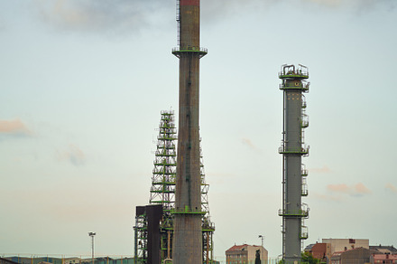 Industrial smokestacks and refinery, an Industrial Photo by SkyNext