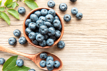 Blueberries on wooden background, a Food & Drink Photo by Olena Rudo