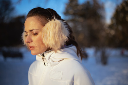 active woman in white jacket with ear warmer, a Sports & Recreation Photo by Alliance Images