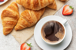 Delicious french breakfast with croissants, coffee and strawberr, a Food & Drink Photo by Olena Rudo