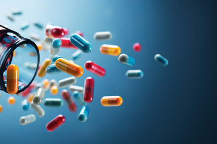 flying pill tablet capsule on blue background. levitation medicine., an Abstract Photo by Natalia Klenova's Shop