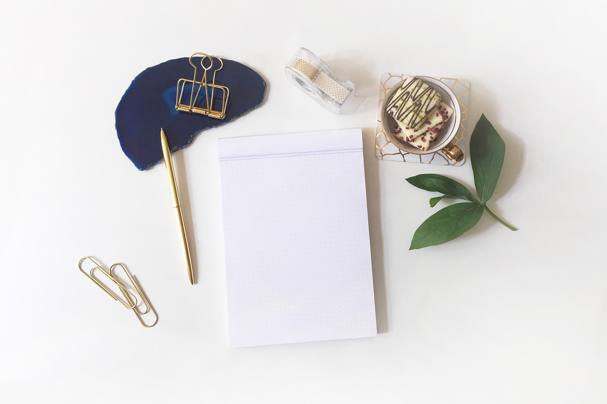 Flatlay arrangement with writing pad, a Photo by Yolo Berlin (Photo 1 of 2)