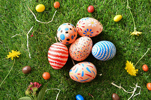 Colorful Hand-Painted Easter Eggs on Grass, a Holiday Photo by Davizro's Market