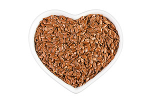 flaxseed in ceramic bowl isolated on, a Food & Drink Photo by NataPhoto