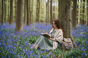 Serene Woman Reading Book in Woods, a Person Photo by Virgo Studio