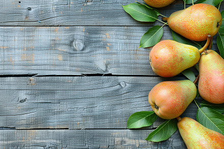 Red pears with leafs and copyspace for text on wooden table, a Food & Drink Photo by AlyaAnd