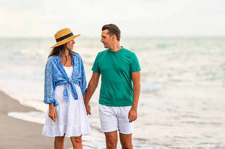 Young couple on white beach during summer vacation.