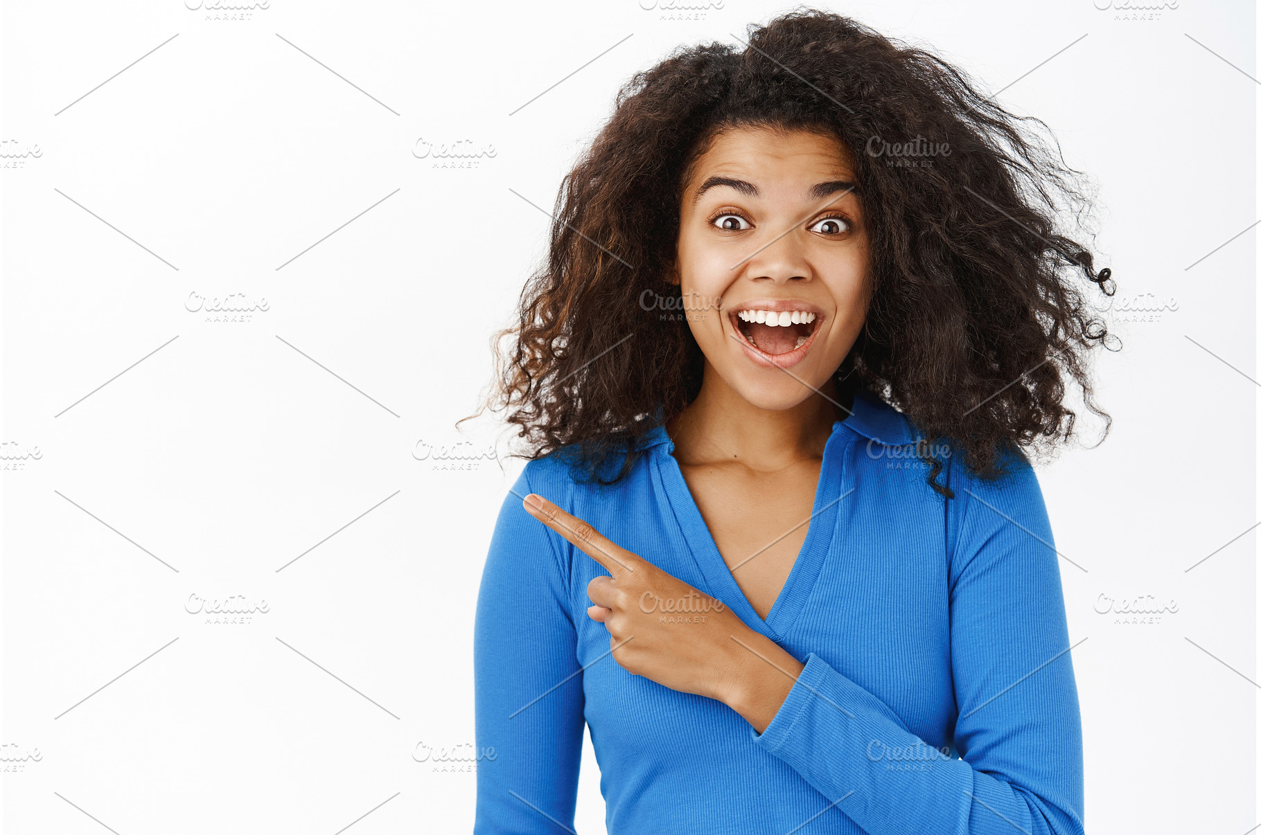 Surprised Black girl, pointing left, a Person Photo by Cookie Studio