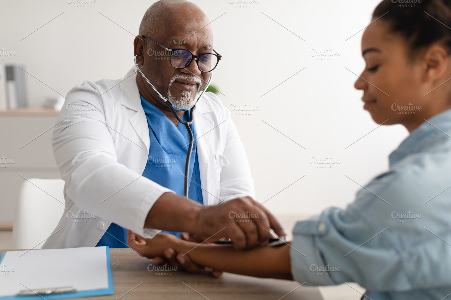 Doctor checking measuring pressure on patient's hand pulse, a Photo by Prostock-Studio