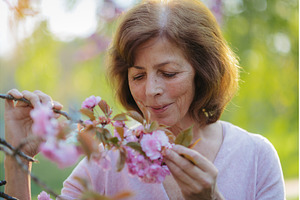 Beautiful senior woman standing, a Person Photo by HalfPoint