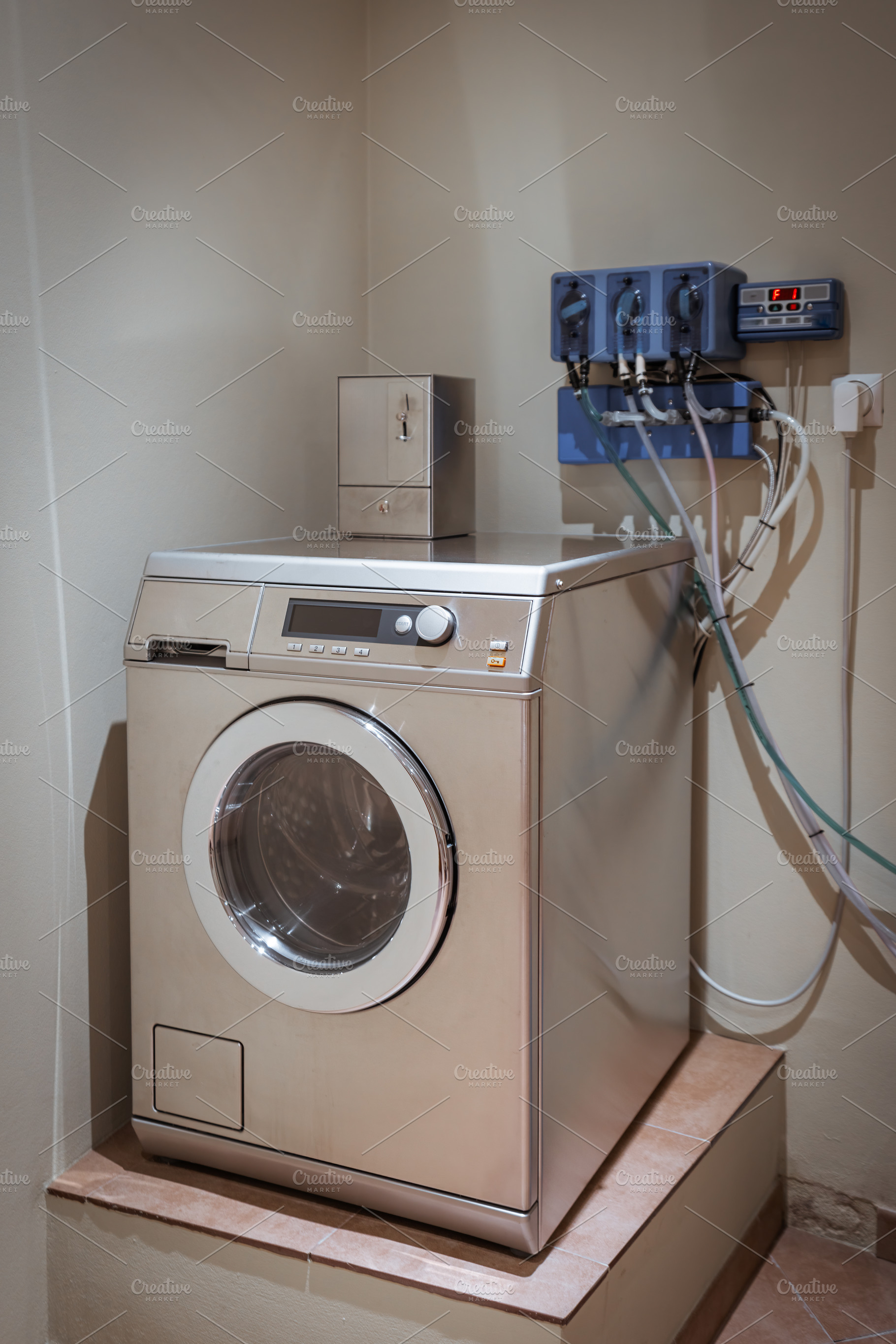 Hostel coin laundry machine, an Industrial Photo by SkyNext