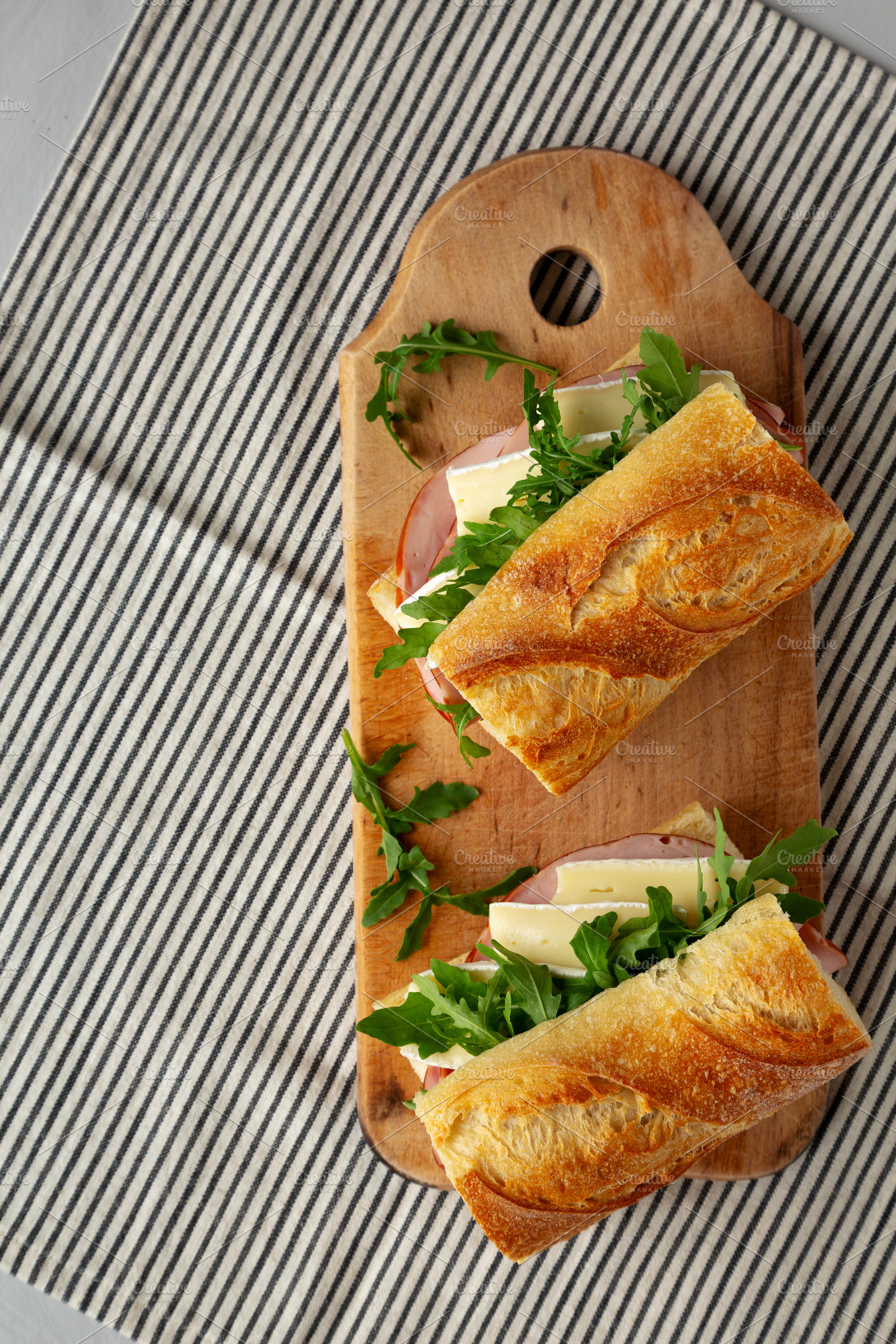 Homemade French Ham and Brie Baguette with Arugula Greens, top v, a Food & Drink Photo by LiudmylaChuhunova