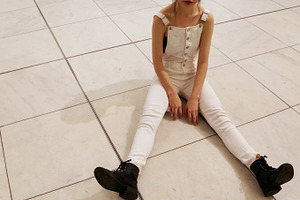 Girl in White Overalls
