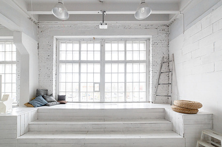 Bright photo studio interior with big window high ceiling white wooden floor, an Architecture Photo by Northern Life