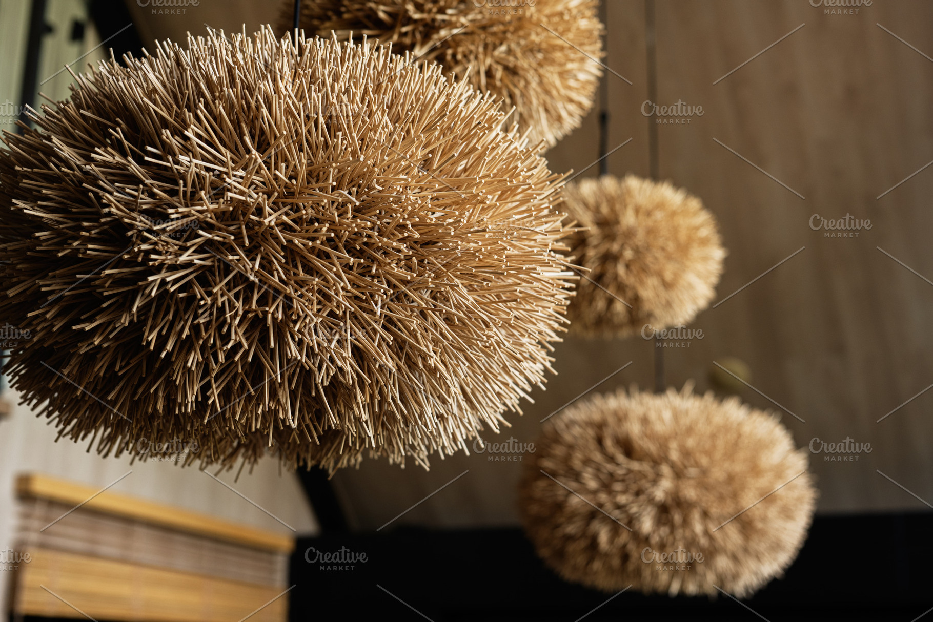 Hanging decorative straw spheres providing natural design and aesthetic texture, a Photo by AS photostudio