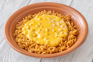 Cheesy Korean ramen with sweet corn and creamy melted cheese in