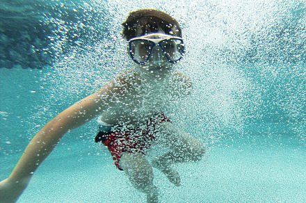 Girl swimming underwater containing bubbles, pool, and water preview 6