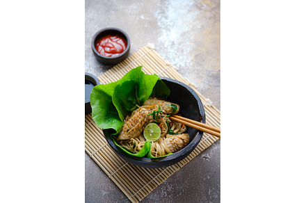 Hot noodles with squid in stone