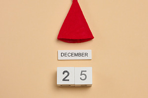 A wooden cube calendar with the date DECEMBER 25th and a red fel, a Holiday Photo by ndanko