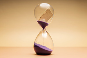 Hourglass with torn paper message, storytelling, unfinished memo, a Photo by salmon.black