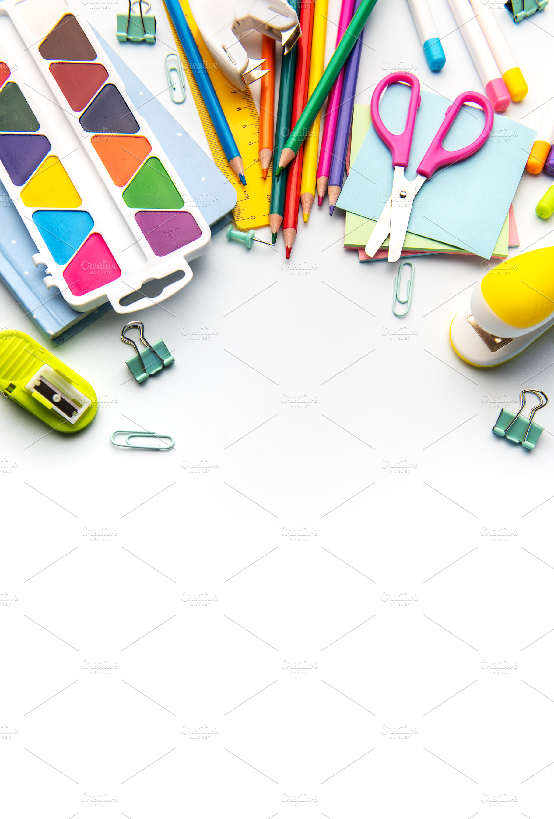 Colorful school and art supplies on white background, a School & Education Photo by Olena Rudo