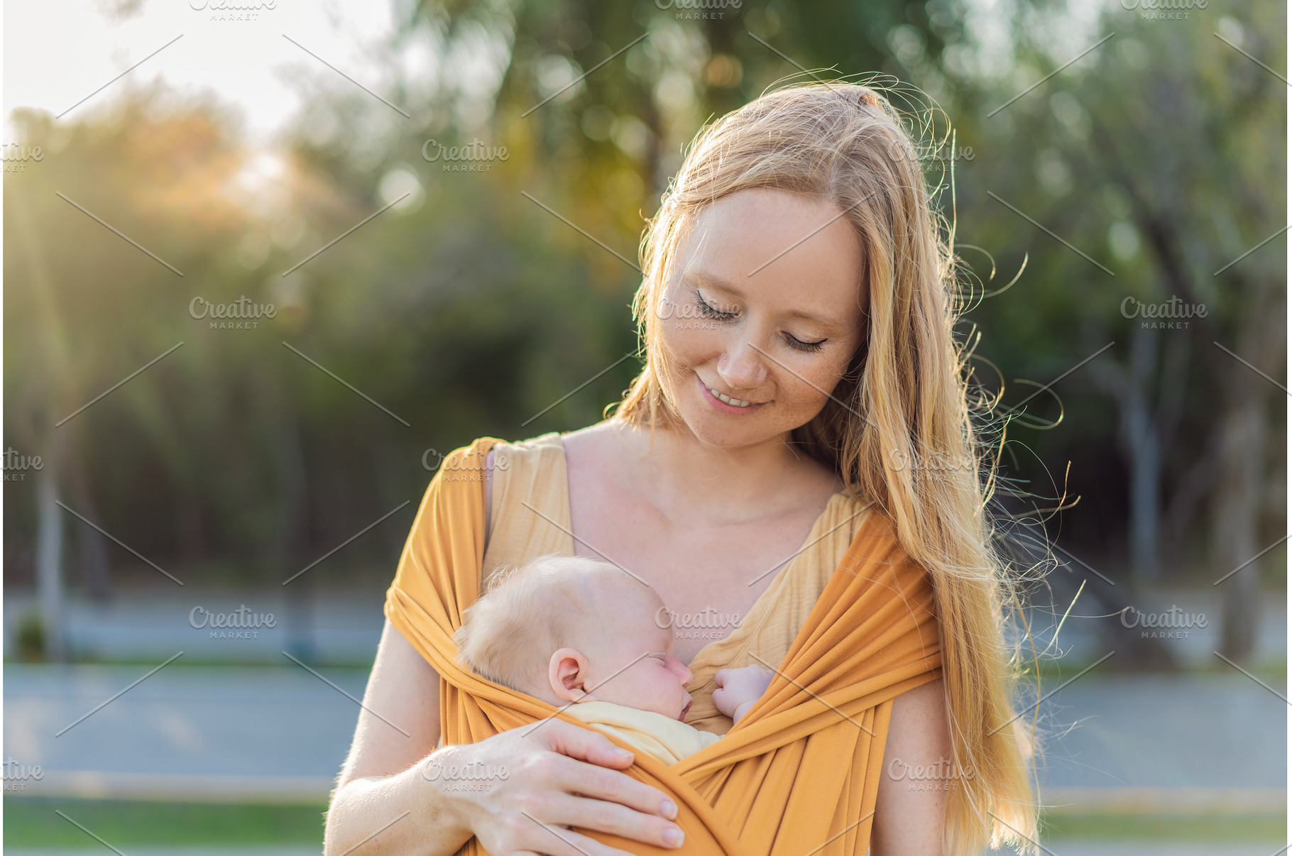 Mother holding her little baby in a, a Person Photo by Elizaveta Galitskaya