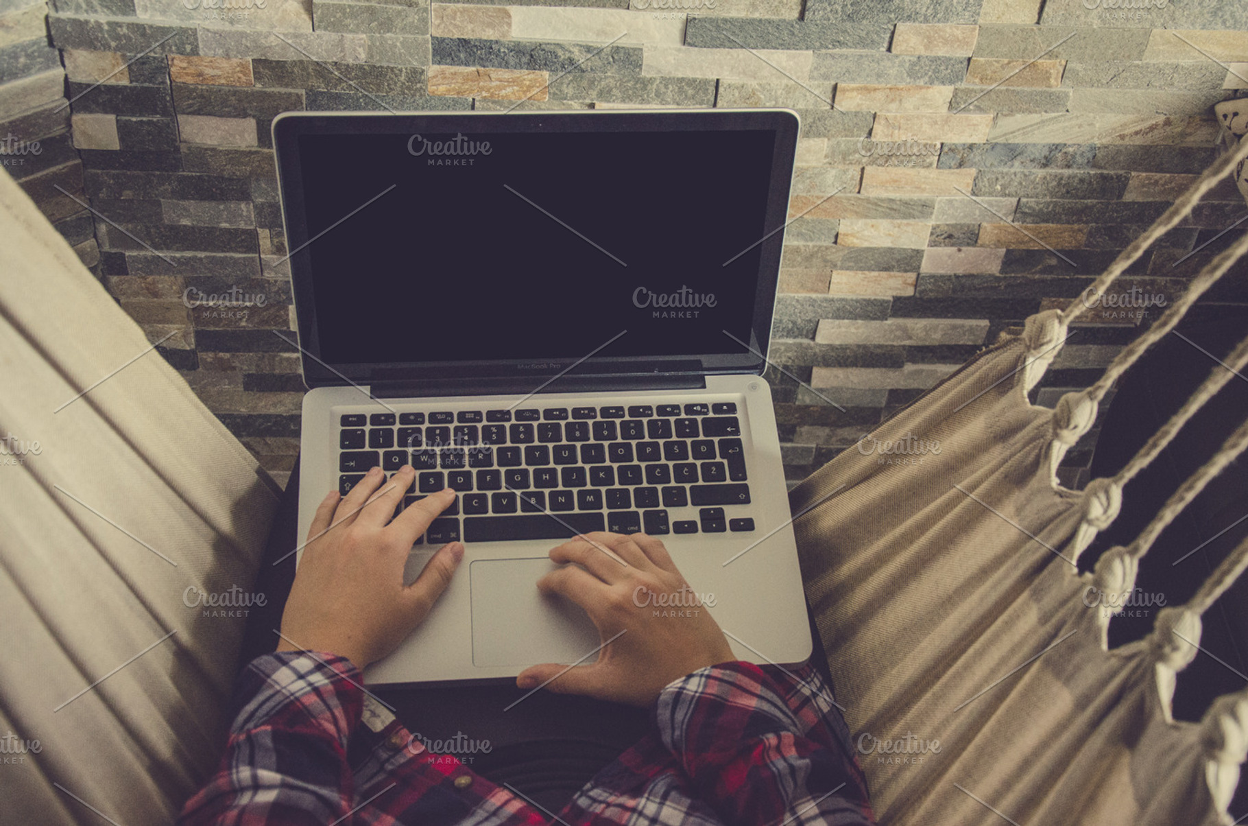 Hipster typing on white mac containing mac, macbook, and laptop