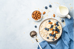 Oatmeal porridge with milk, bananas, a Food & Drink Photo by Nadia-nb
