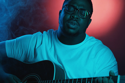 Vocalist show man guitarist playing singing smoke, a Person Photo by Photo Drive Studio