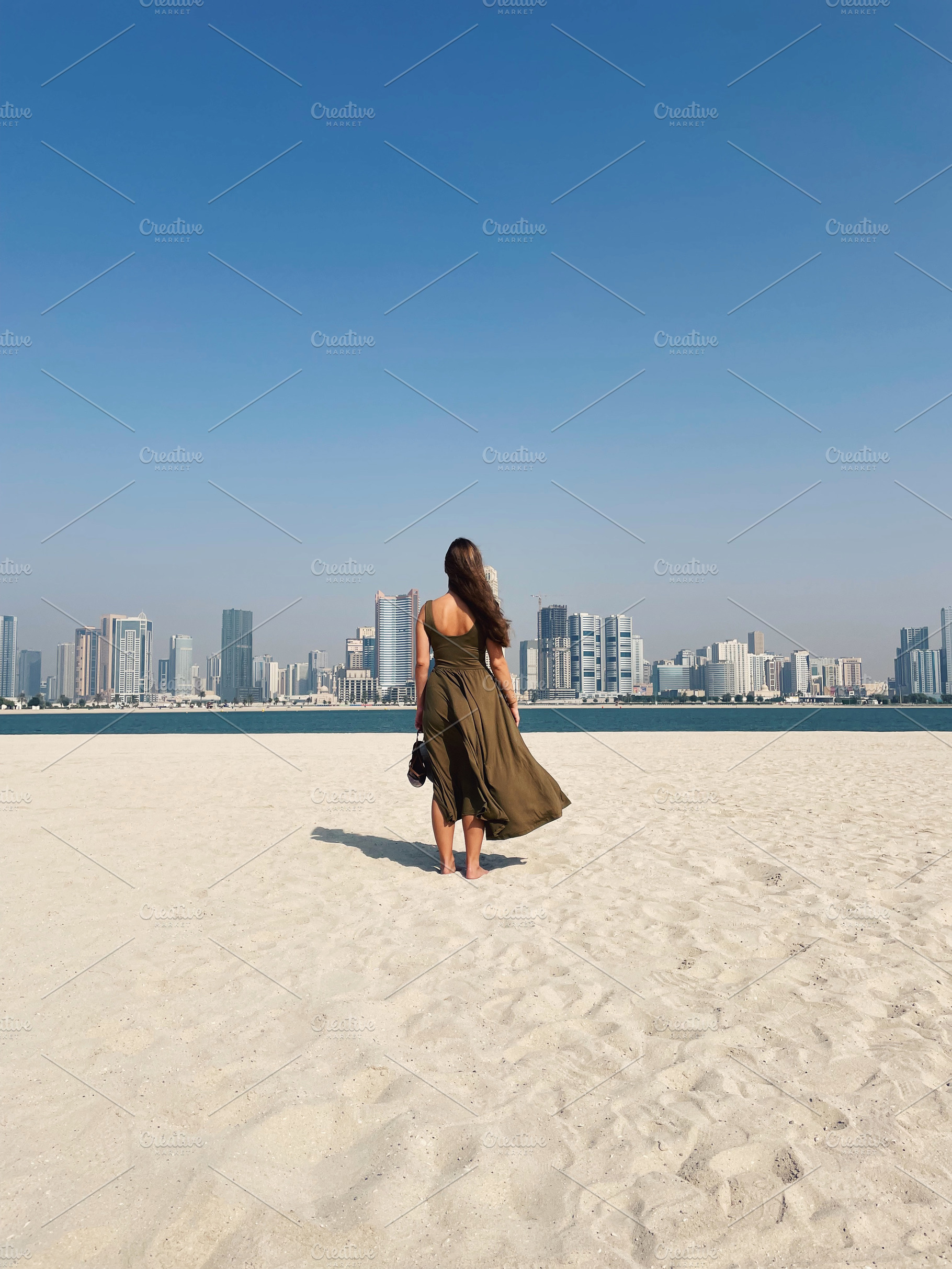 Back view of young female in dress, a Person Photo by Artem Varnitsin