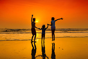 Dancing on the beach at sunset, a Person Photo by Lucky Photographer (Thumbnail 2 of 2)